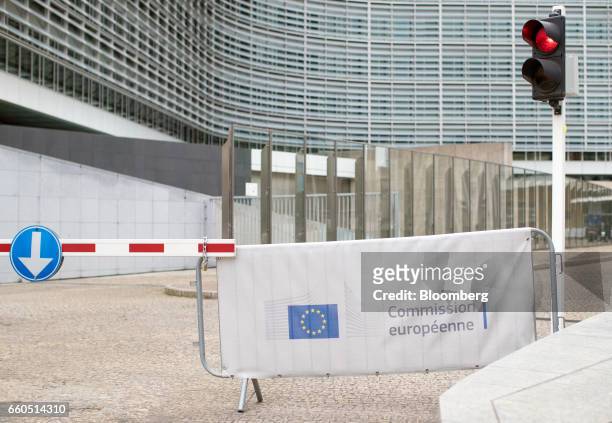 European Union flag sits on a barrier outside the European Commission Berlaymont building in Brussels, Belgium, on Thursday, March 30, 2017. Prime...