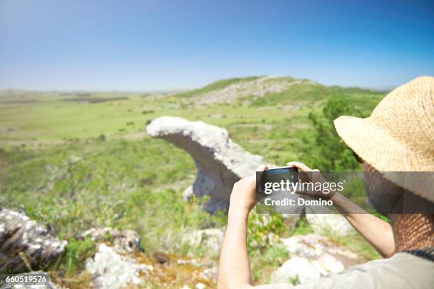 man taking a picture of the view - un solo hombre de mediana edad stock pictures, royalty-free photos & images