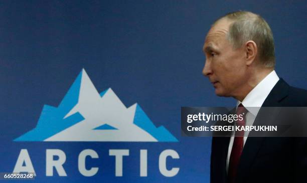 Russian President Vladimir Putin leaves after a meeting with Finnish President as part of the International Arctic Forum in Arkhangelsk on March 30,...