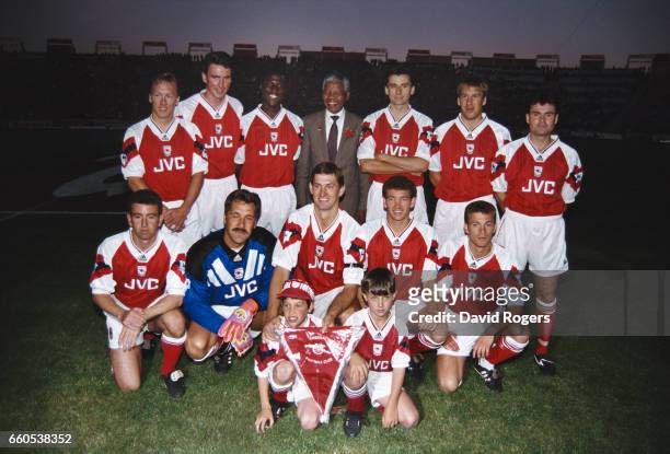The Arsenal team line up together for a group photograph with Nelson Mandela prior to a friendly match, Back Row left to right Lee Dixon, Andy...