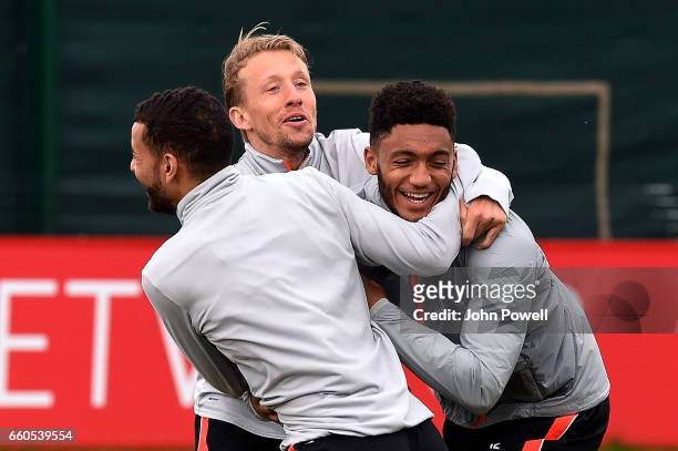 Lucas, Joe Gomez and Kevin Stewart of Liverpool during a training session at Melwood Training Ground on March 30, 2017 in Liverpool, England.