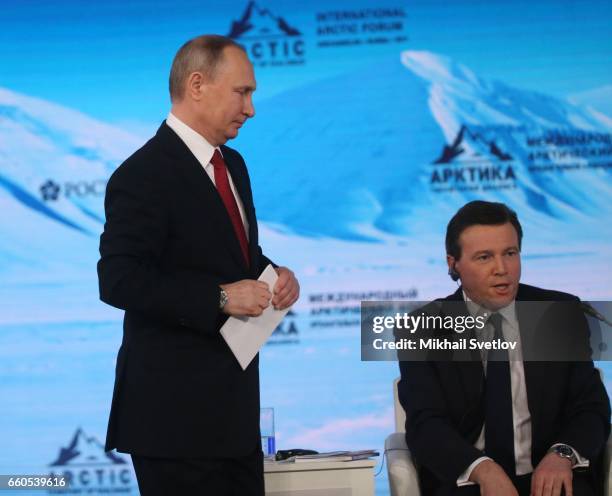 Russian President Vladimir Putin and CNBC economy journalist Geoff Cutmore seen during the International Arctic Forum "Arctic: Territory of dialogue"...