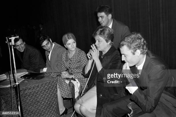 From left, French director Costa Gavras, French actors Charles Denner, Catherine Allegret, Simone Signoret, speaking with her husband Yves Montand...