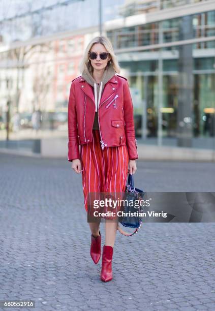 Lisa Hahnbueck wearing Coach ICON Moto Leather Jacket, Kith Cropped Sweatshirt, Stine Goya Marnie Silk Shirt, Louis Vuitton Pokerface Ankle boot,...