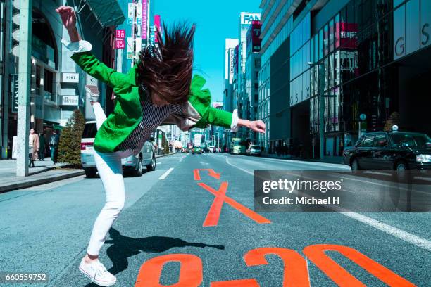 woman jumping in the city - crazy car fotografías e imágenes de stock