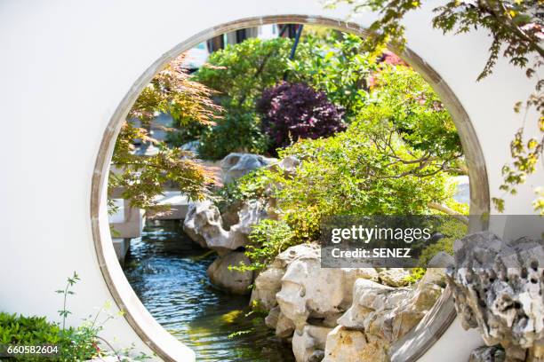 chinese garden - formal garden gate stock pictures, royalty-free photos & images