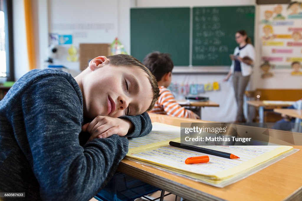 Young boy sleeping in primary school