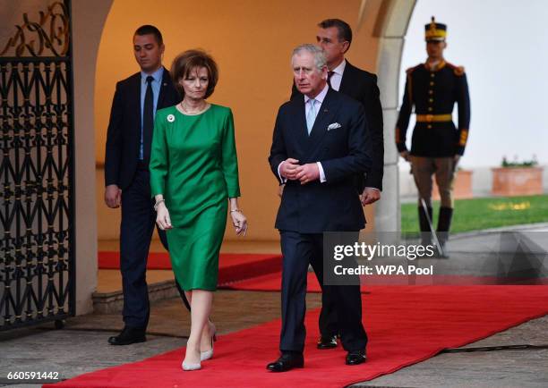 Prince Charles, Prince of Wales walks with Crown Princess Margareta of Bucharest during a Tea with the Romanian Royal Family on the second day of his...