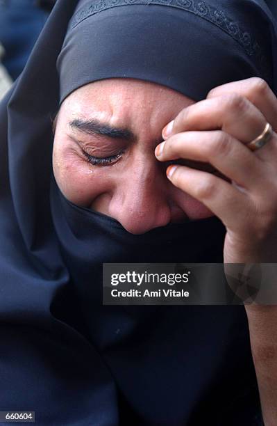 Kashmiri woman mourns the death of Fayez Ahmed Lone on June 7, 2002 in Srinagar, the summer capital of the Indian held state of Jammu and Kashmir....