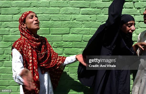 Kashmiri women mourn the death of Fayez Ahmed Lone on June 7, 2002 in Srinagar, the summer capital of the Indian held state of Jammu and Kashmir....
