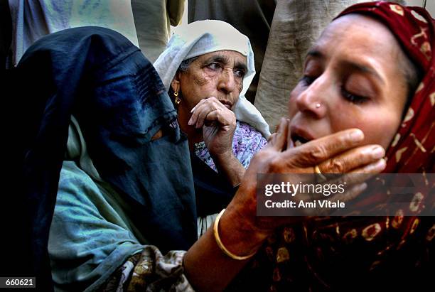 Kashmiri women mourn the death of Fayez Ahmed Lone on June 7, 2002 in Srinagar, the summer capital of the Indian held state of Jammu and Kashmir....