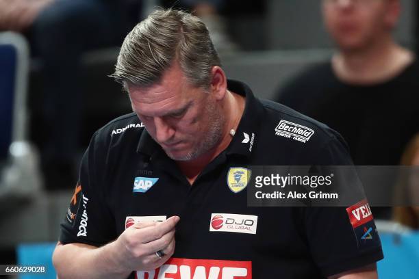 Head coach Nikolaj Jacobsen of Rhein-Neckar Loewen searches his chewing gum during the EHF Champions League Quarter Final Leg 2 match between Rhein...