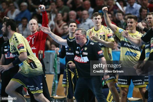 Head coach Nikolaj Jacobsen and players of Rhein-Neckar Loewen react during the EHF Champions League Quarter Final Leg 2 match between Rhein Neckar...