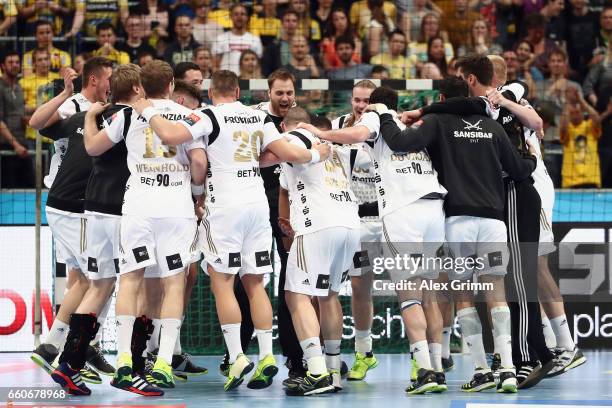 Players of Kiel celebrate after winning the EHF Champions League Quarter Final Leg 2 match between Rhein Neckar Loewen and THW Kiel at SAP Arena on...