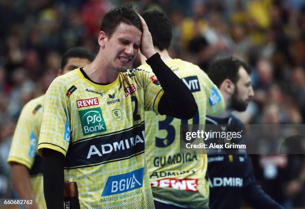 Andy Schmid and team mates of Rhein-Neckar Loewen react after the EHF Champions League Quarter Final Leg 2 match between Rhein Neckar Loewen and THW...