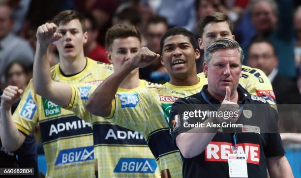 Head coach Nikolaj Jacobsen and players of Rhein-Neckar Loewen react during the EHF Champions League Quarter Final Leg 2 match between Rhein Neckar...