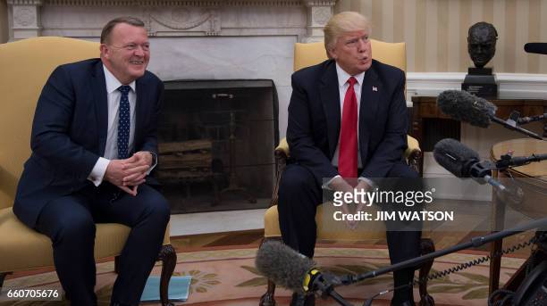 President Donald Trump meets with Danish Prime Minister Lars Lokke Rasmussen at the White House in Washington, DC, March 30, 2017. / AFP PHOTO / JIM...
