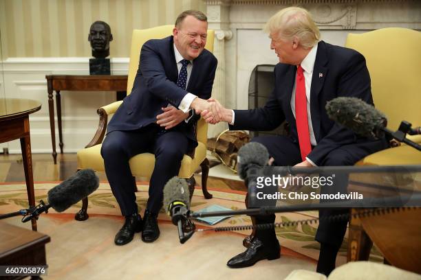 President Donald Trump and Prime Minister Of Denmark Lars Lokke Rasmussen shake hands for the press in the Oval Office at the White House March 30,...