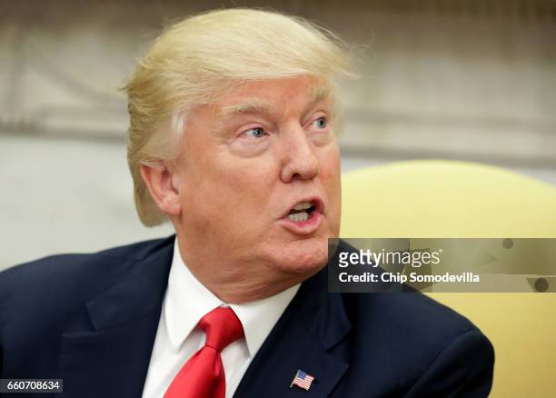 President Donald Trump answers reporters' questions during a photo opportunity with Prime Minister Of Denmark Lars Lokke Rasmussen in the Oval Office...