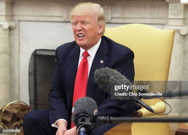 President Donald Trump answers reporters' questions during a photo opportunity with Prime Minister Of Denmark Lars Lokke Rasmussen in the Oval Office...