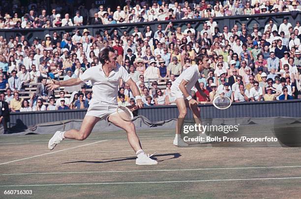 Australian tennis players John Newcombe and Tony Roche pictured in action together during the final of the Men's Doubles tournament at the Wimbledon...