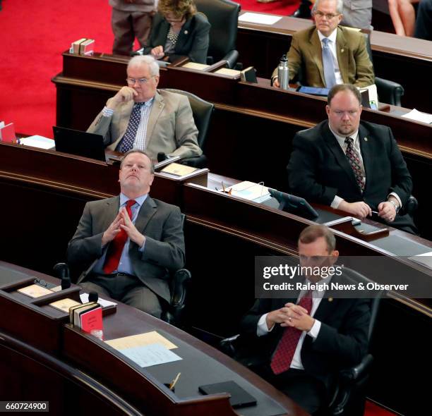 Senate President pro tem Phil Berger , left front, and Sen. Harry Brown , right front, and other senators listen as HB 142 is debated on the Senate...