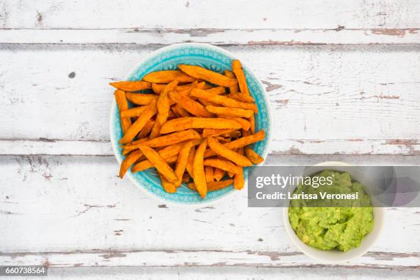 sweet potato french fries with avocado sauce - sweet potato fries stock pictures, royalty-free photos & images