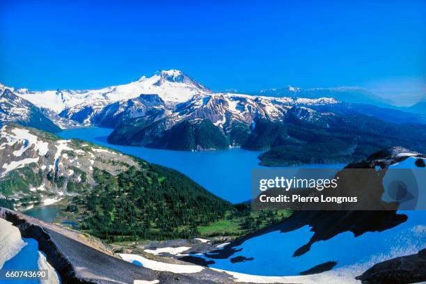 view of mount garibaldi and garibaldi lake in garibaldi provincial park, british columbia, canada from the top of black tusk mountain, near whistler. - coast ranges stock pictures, royalty-free photos & images