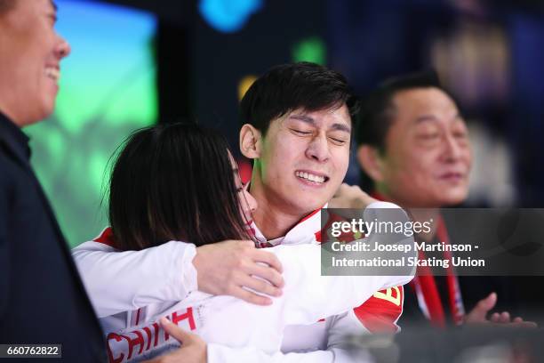 Wenjing Sui and Cong Han of China react at kiss and cry in the Pairs Free Skating during day two of the World Figure Skating Championships at...