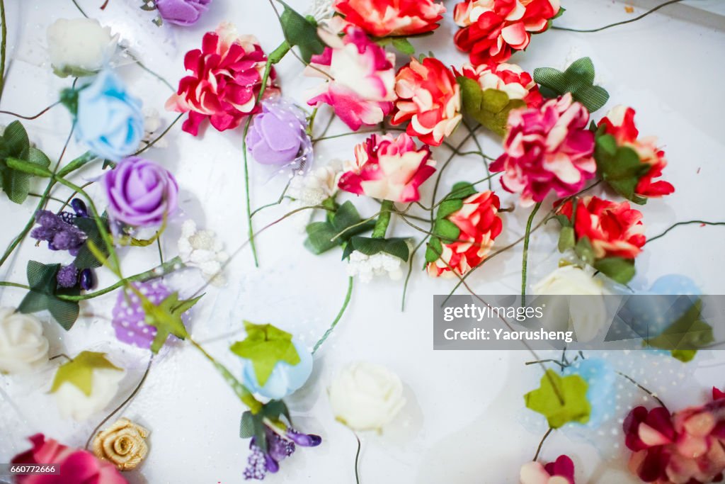 Pink flowers on white wooden tables