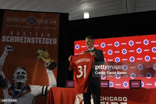 Bastian Schweinsteiger poses with his jersey as the The Chicago Fire Introduce him during a press conference on March 29, 2017 at the The PrivateBank...