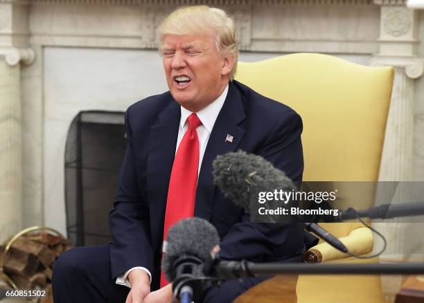 President Donald Trump, reacts during a meeting with Lars Lokke Rasmussen, Denmark's prime minister, not pictured, in the Oval Office at the White...