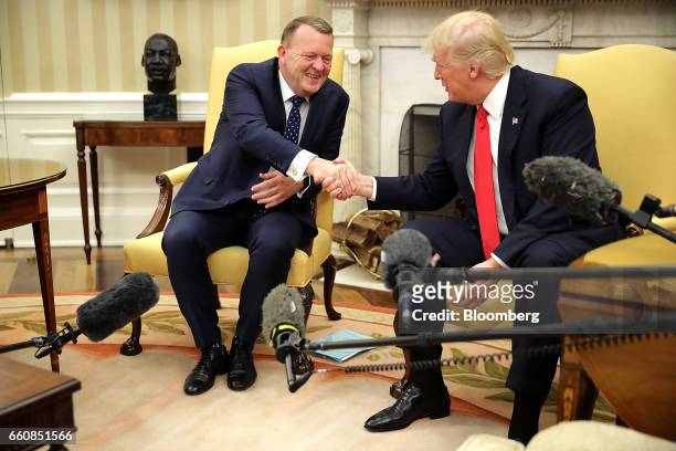 President Donald Trump, right, shakes hands with Lars Lokke Rasmussen, Denmark's prime minister, during a meeting in the Oval Office at the White...