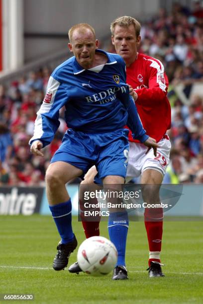 Cardiff City's Andy Campbell is tugged at by Nottingham Forest's Jon-Olav Hjelde