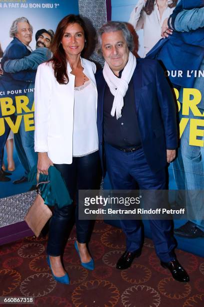 Actor of the movie, Christian Clavier and his wife Isabelle de Ajauros attend the "A bras ouverts" Paris Premiere at Cinema Gaumont Opera on March...
