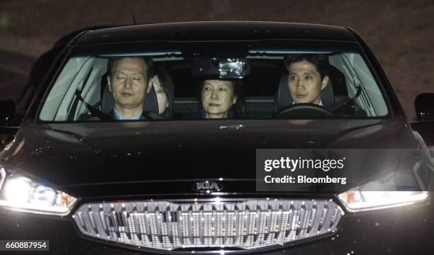 Park Geun-hye, former president of South Korea, center, leaves the Seoul Central Prosecutors' Office in Seoul, South Korea, on Friday, March 31,...