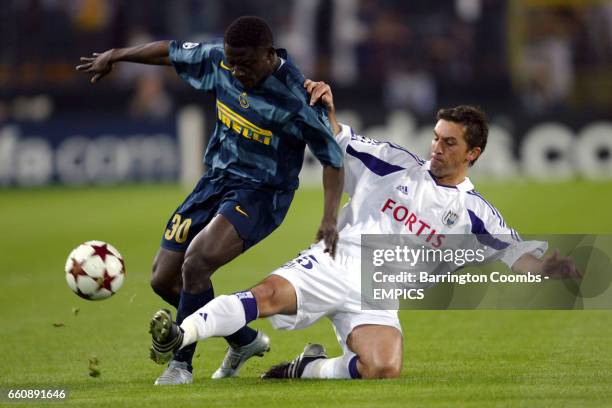 Anderlecht's Besnik Hasi slides in to tackle Inter Milan's Obafemi Martins