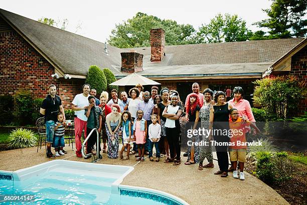 portrait of multigenerational family in backyard - large family ストックフォトと画像