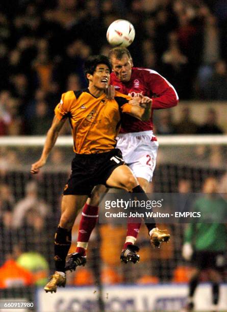 Nottingham Forest's Jon Olav Hjelde heads the ball away from Wolverhampton Wanderers' Ki-Hyeon Seol