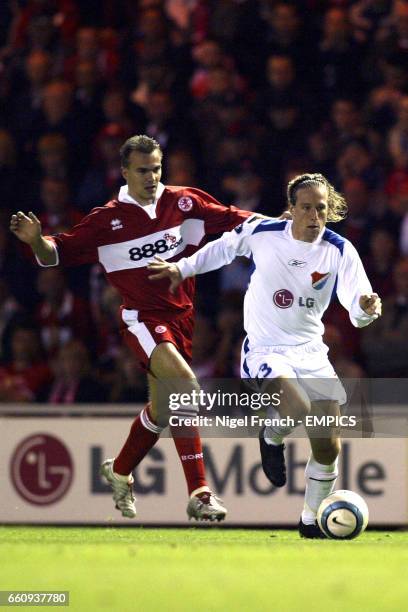 Banik Ostrava's Mario Licka leaves behind Middlesbrough's Szilard Nemeth