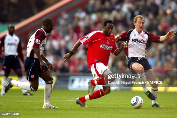 Charlton Athletic's Jason Euell is tackled by Middlesbrough's Ray Parlour and George Boateng