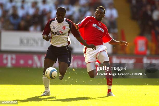 Charlton Athletic's Jason Euell stretches to tackle Middlesbrough's George Boateng