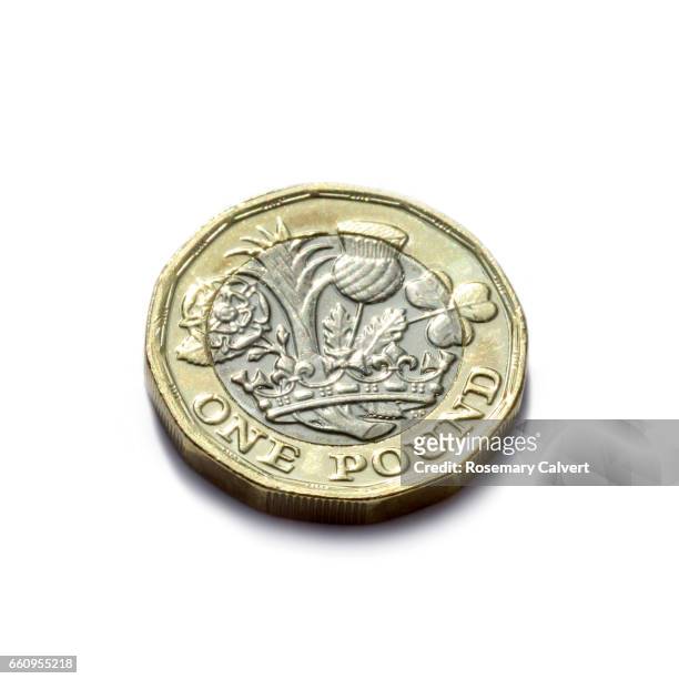 one pound coin newly minted and released in uk in 2017. - one pound coin stock pictures, royalty-free photos & images