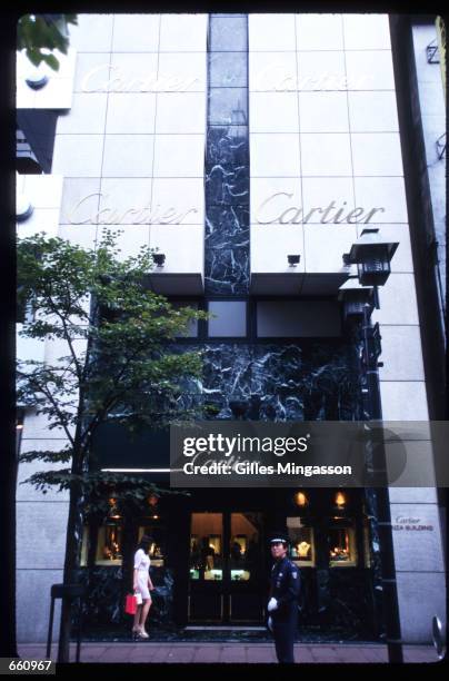 Guard stands in front of a Cartier store September 2, 1998 in Tokyo, Japan. Tokyo is a host to many European and American restaurants and shops.