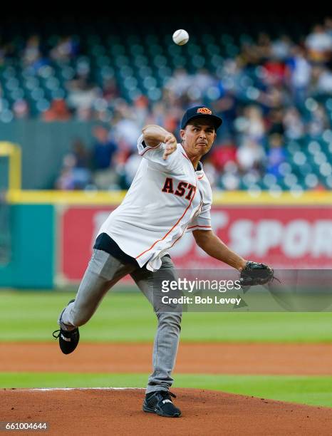 Golfer Rickie Fowler throws out first pitch during an exhibition game at Minute Maid Park on March 30, 2017 in Houston, Texas.
