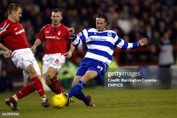 Nottingham Forest's Jon Olav Hjelde is tackled hard by Queens Park Rangers' Adam Miller