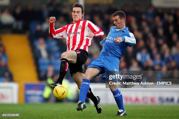 Cardiff City's Willie Boland and Sunderland's Dean Whitehead