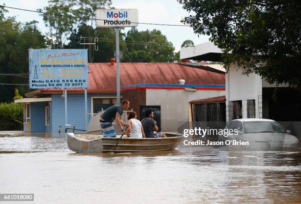 Residents use a boat on March 31, 2017 in South Murwillumbah, Australia. Heavy rain has caused flash flooding in south east Queensland and Northern...