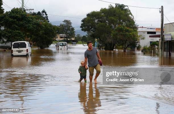 Local residents in the main street on March 31, 2017 in Billinudgel, Australia. Heavy rain has caused flash flooding in south east Queensland and...