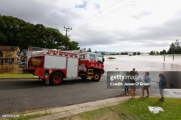 Fire crew attend the scene on March 31, 2017 in South Murwillumbah, Australia. Heavy rain has caused flash flooding in south east Queensland and...